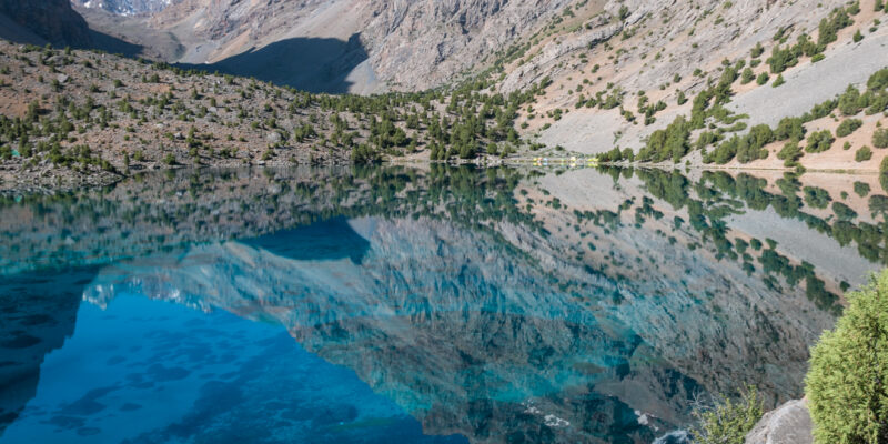 Reflection of the mountains in a blue lake